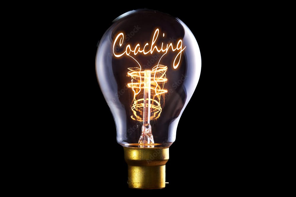 Lightbulb that says coaching